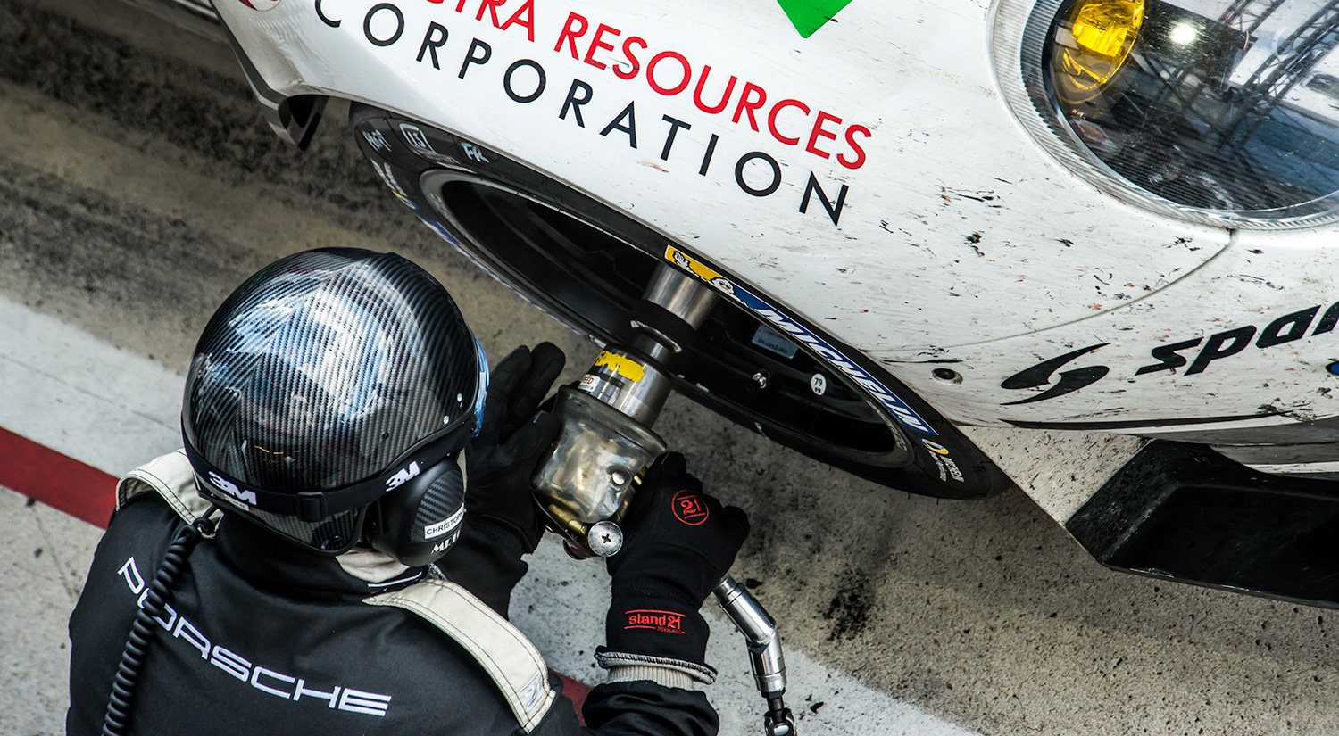 Mechanic changes a wheel on the No. 76 Porsche 997,  24 hrs of Le Mans, 2014